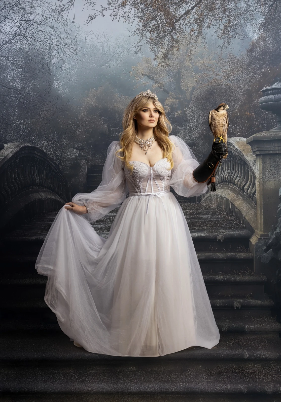 Woman in a white gown holding a falcon before the Victorian Arch Bridge backdrop