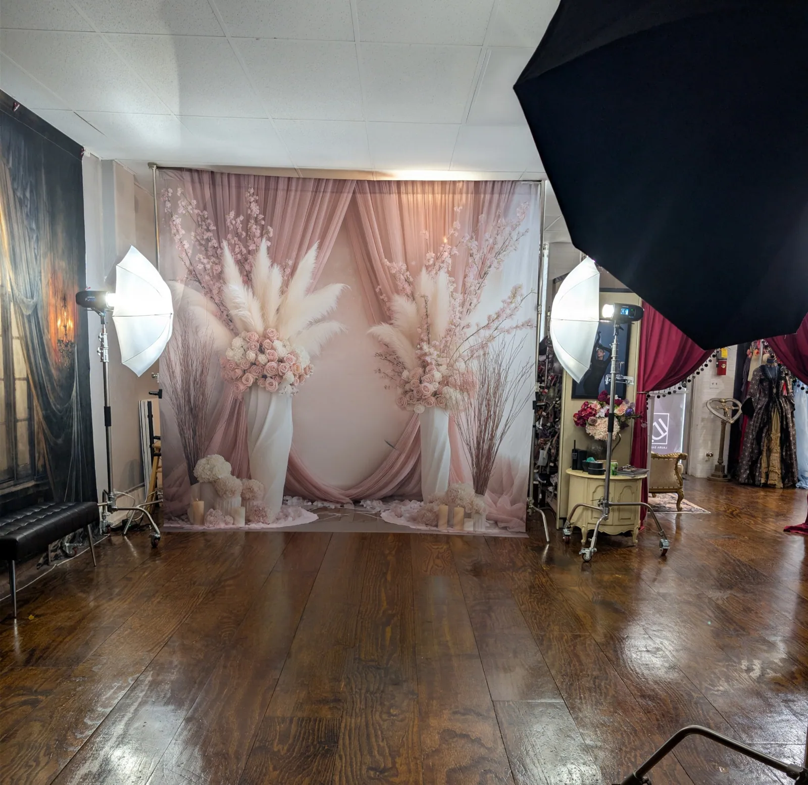 A floral background styled for a dramatic gown portrait — behind the scenes