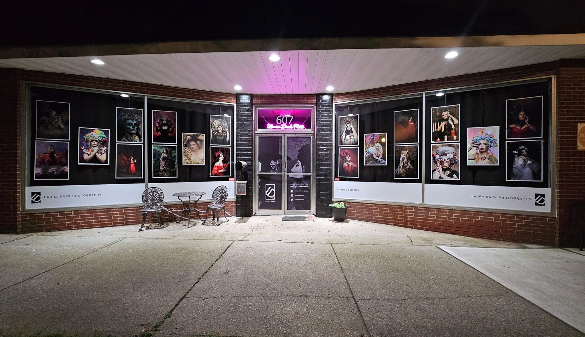 The Main Street storefront of Laura Dark Photography beneath the illuminated 607 sign