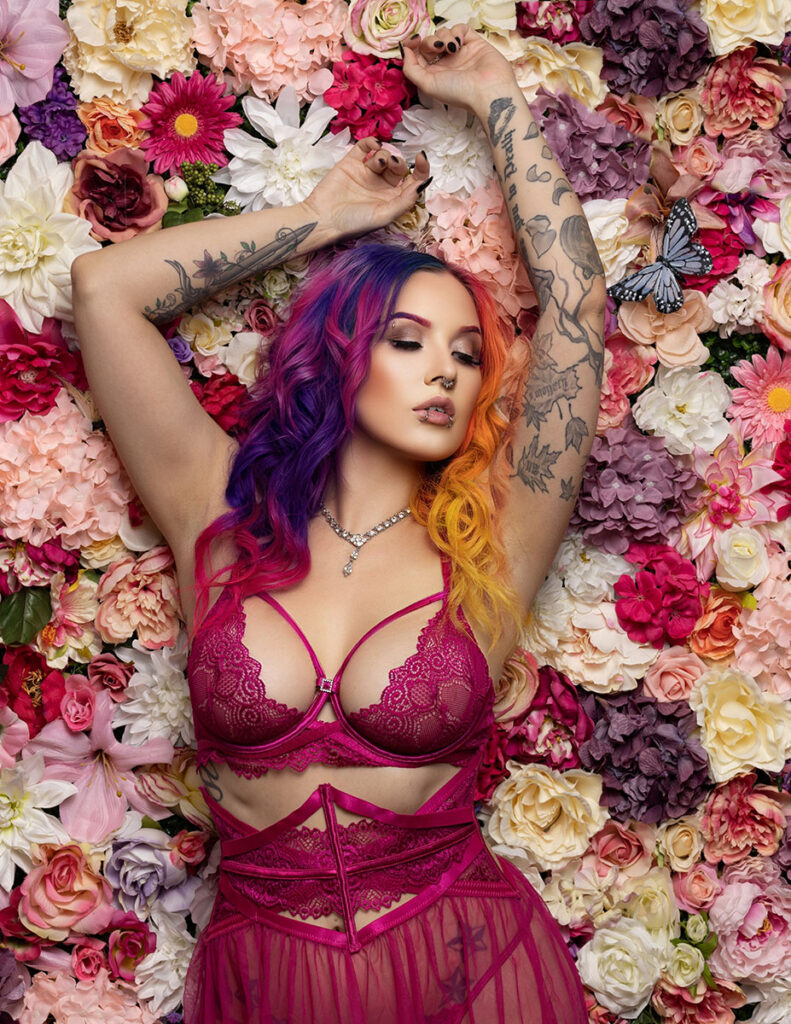 Woman with colorful hair in magenta lingerie during boudoir photography in Columbus, Ohio