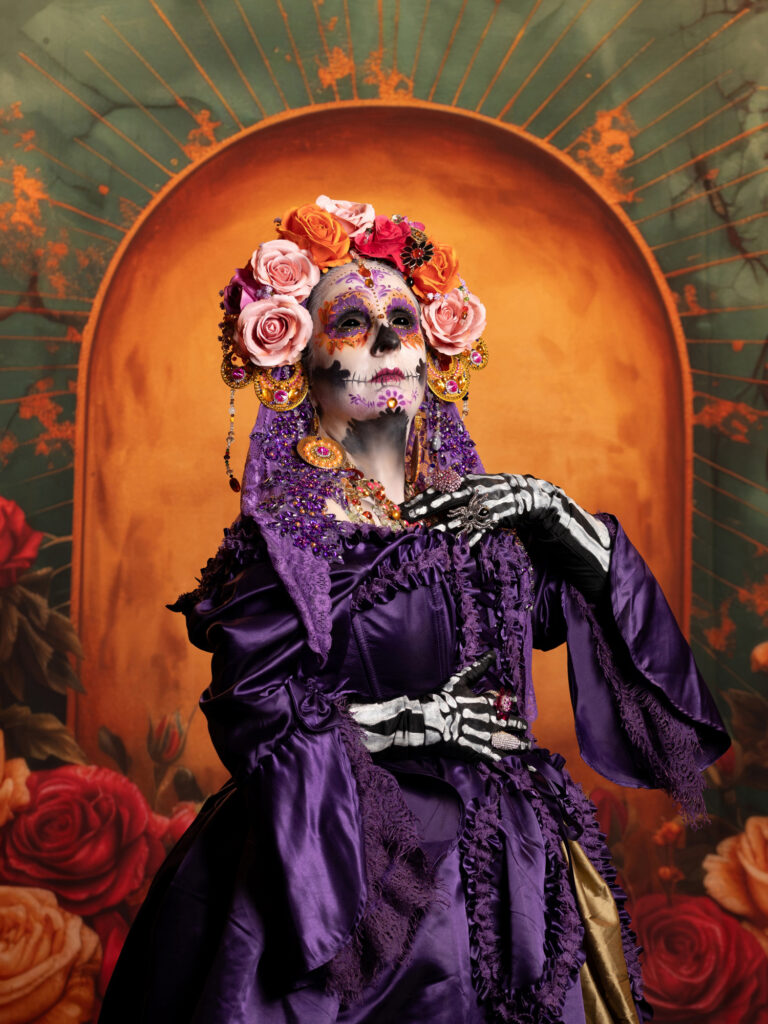Ornate Day of the Dead portrait in rich purple and orange