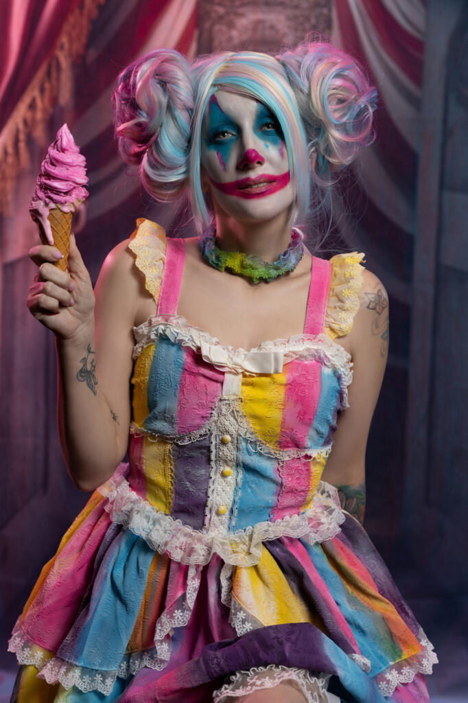Laura Dark — Colorful surreal jester portrait with playful pastel styling
