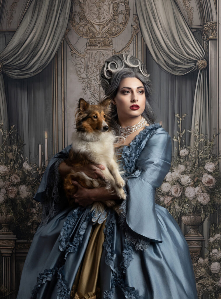 Silver-haired woman in a blue Victorian gown holding a collie in an ornate room.