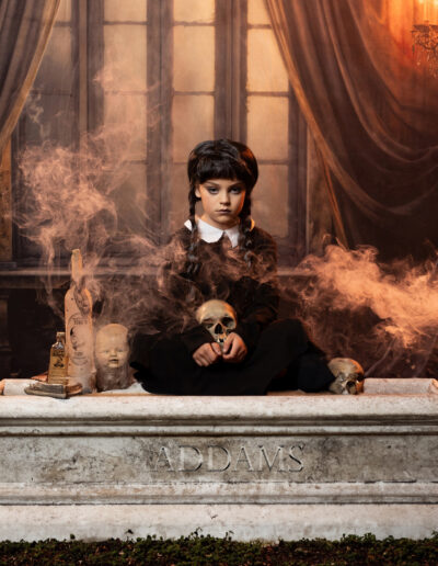 Dark Victorian character surrounded by dolls and drifting floor fog