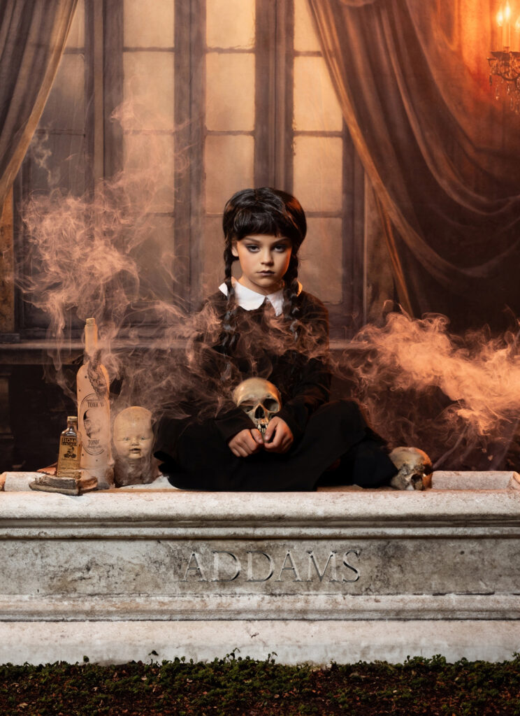 Dark Victorian character surrounded by dolls and drifting floor fog