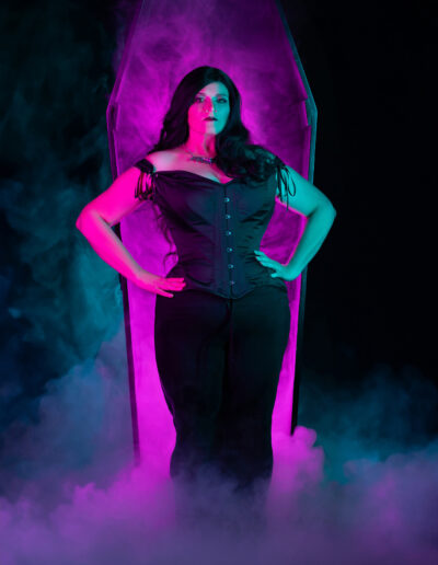 Laura Dark — Gothic character portrait illuminated with magenta and teal light