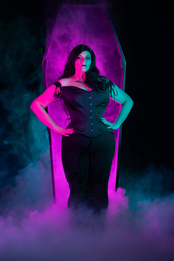 Laura Dark — Gothic character portrait illuminated with magenta and teal light