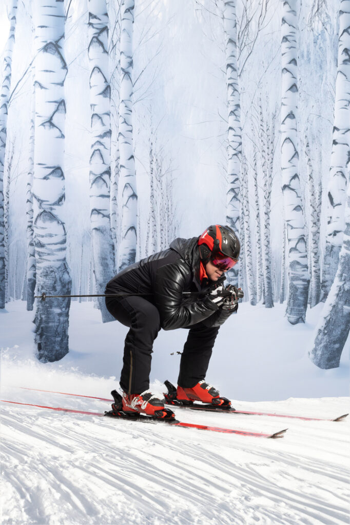 Masked black and red creature crouching in a snowy white forest.