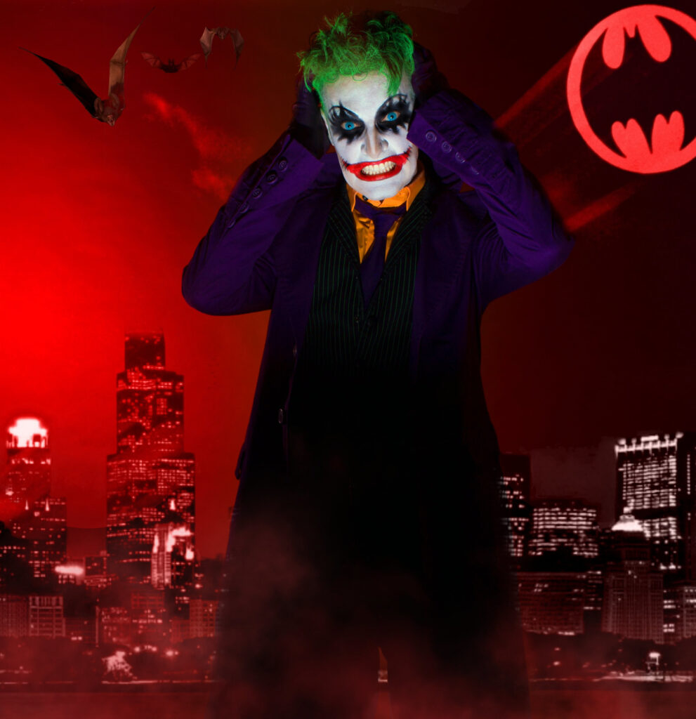 Green-haired comic-book villain in a dark suit against a vivid red city background.